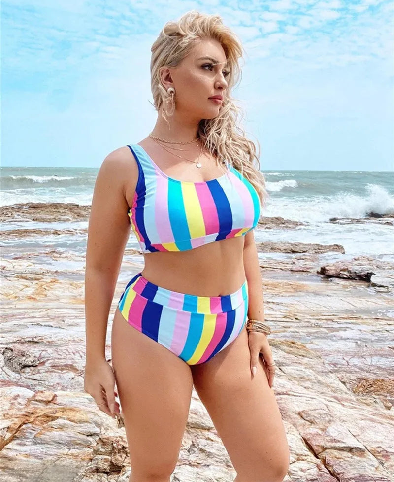 Women's plus size split bikini in polyester with spandex lining, available in XL to 4XL and black, blue or multicolour.