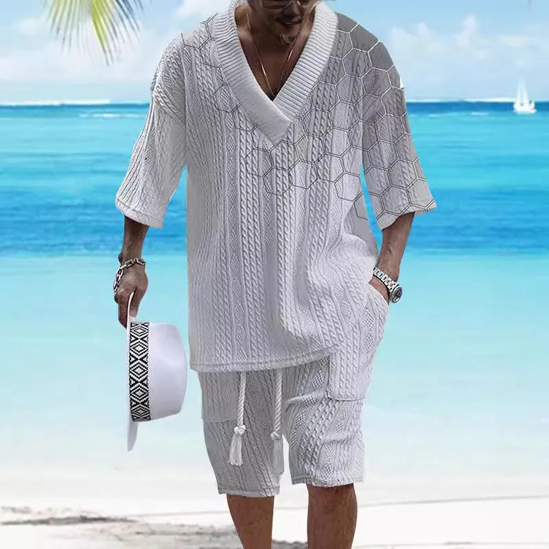 Man wearing a printed drop-shoulder short-sleeved knitted top with matching shorts.