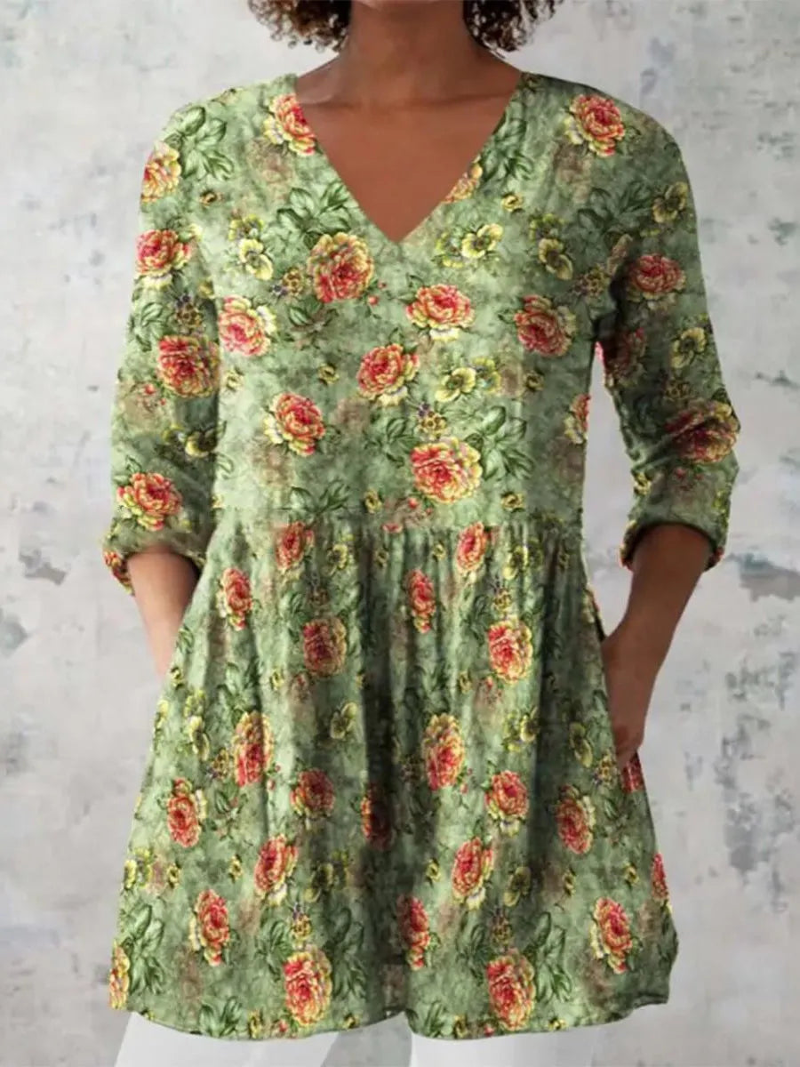 Women's printed wave-pattern loose dress with wide waist and three-quarter sleeves on a mannequin.