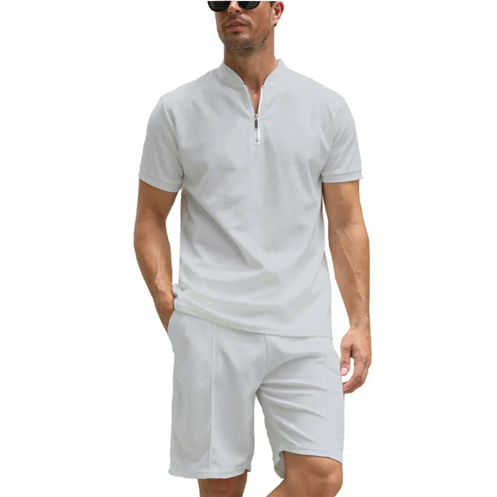 Men's solid colour short sleeve polo shirt and matching trousers two-piece set.