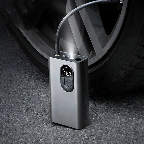 Baseus Energy Pump CRCQB02 cordless tyre inflator with all-metal body and LED light on dark background