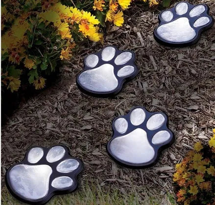 Black bear paw print solar garden light with integrated solar panel pole