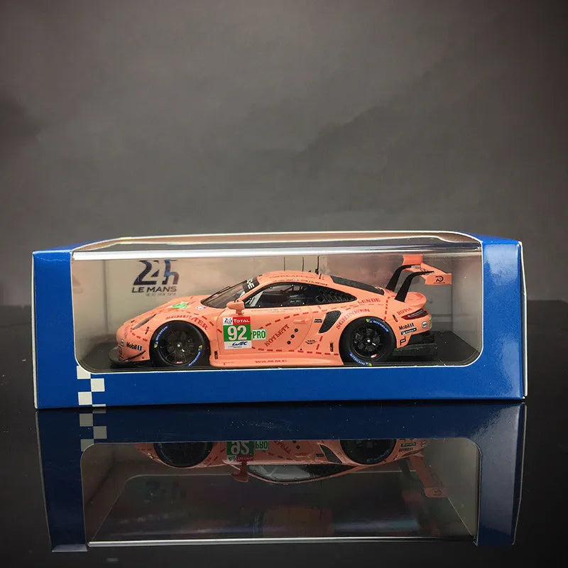Pink 1:64 scale resin Porsche supercar model body, approx. 7 x 3.2 x 2 cm, with 10 x 4 x 3.5 cm display box