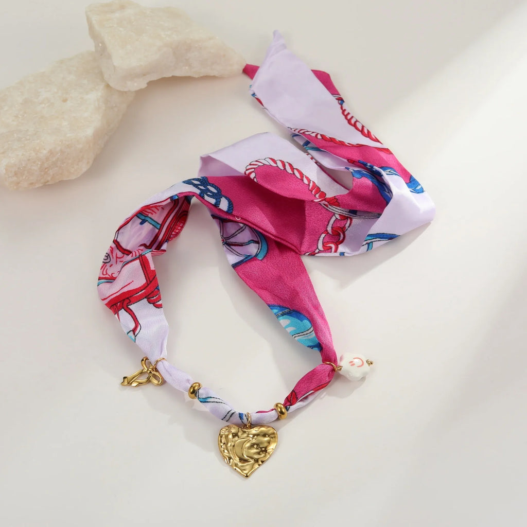 Stainless steel necklace and bracelet set with geometric pendant featuring a colourful silk scarf insert
