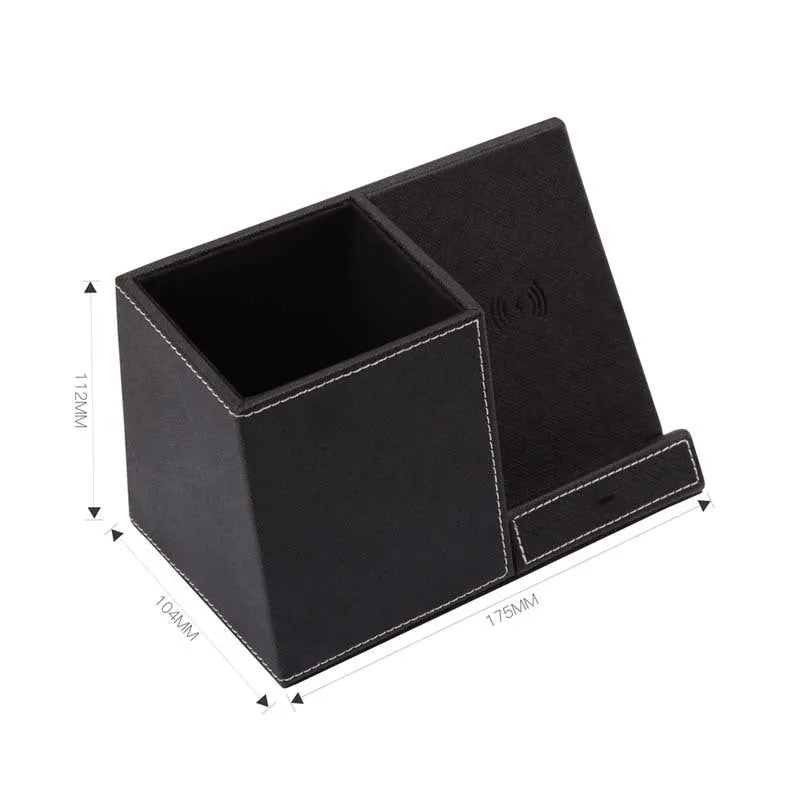 Black leather desk organiser with pen slots and a wireless phone charging pad on top