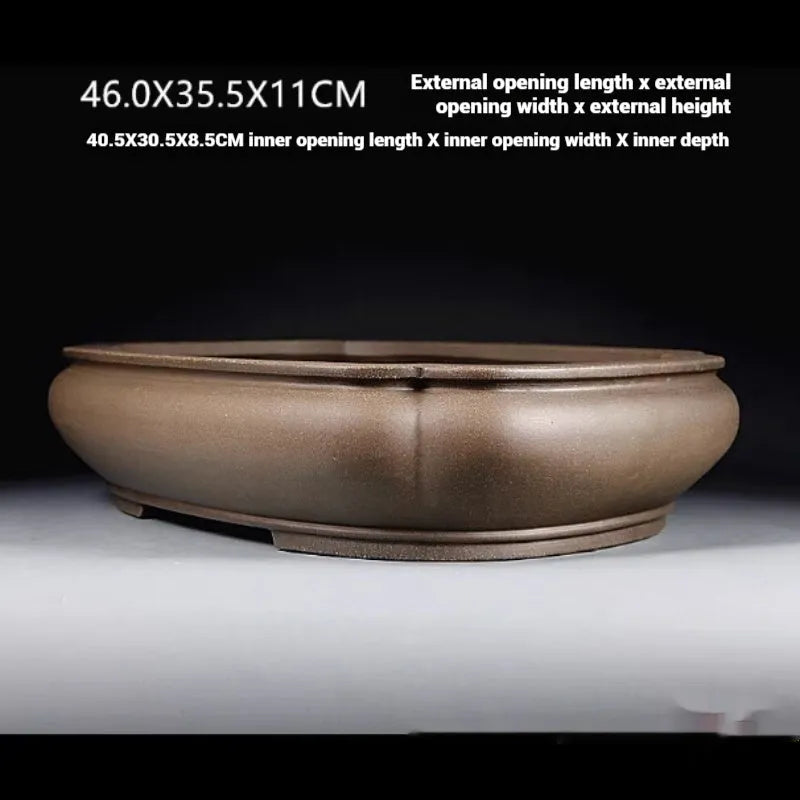 Handmade antique papaya-shaped purple clay flower pot for large plants.