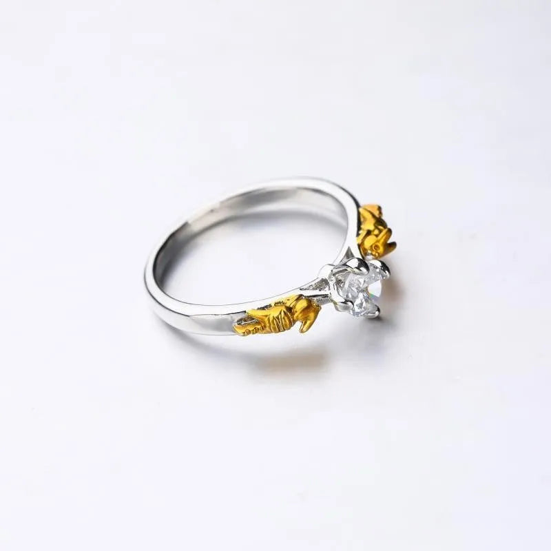 Detailed black gold copper crown ring on a finger, showing crown modelling and metallic finish.