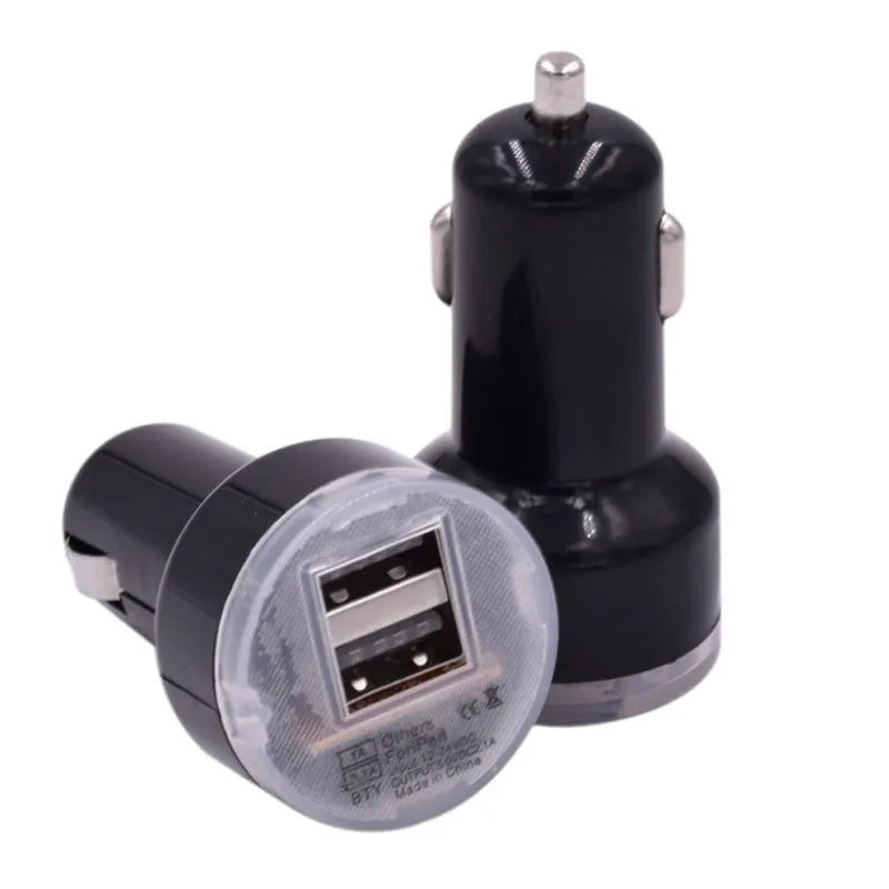 Black or white two-port car charger plugging into a 12V vehicle socket for in-car USB charging