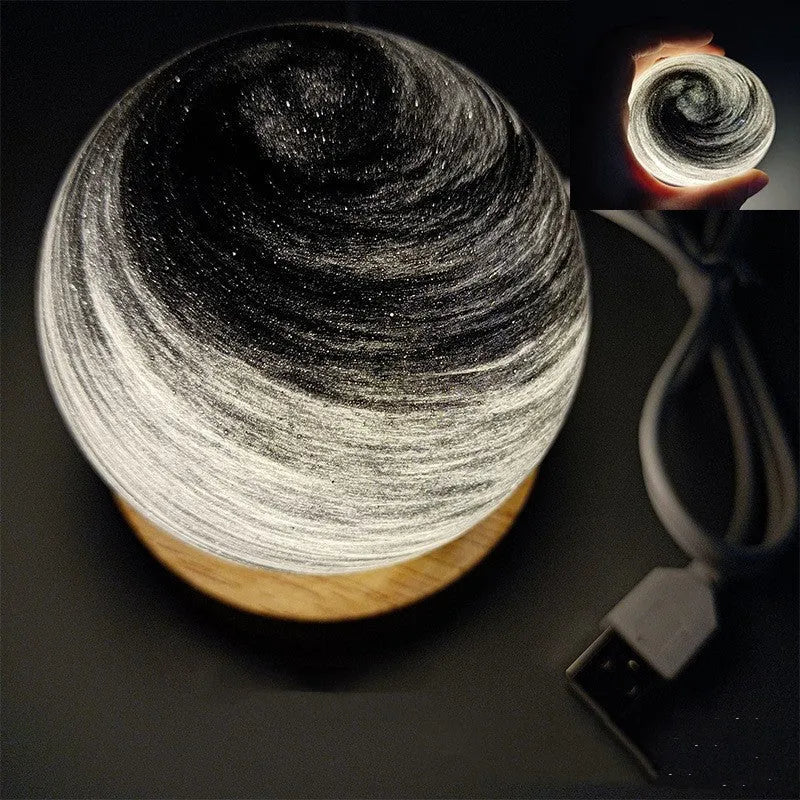 Modern simple style planet night light with USB plug and electrodeless dimming on its base.