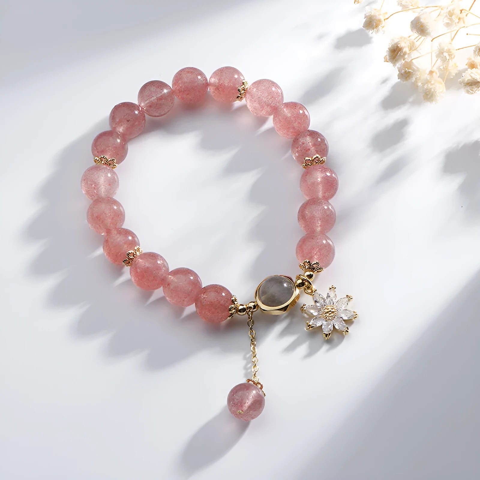 Natural strawberry quartz Mori-style bracelet with floral details on electroplated metal