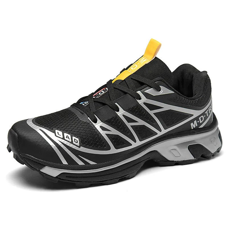 Low-top hiking shoes in artificial leather with mesh lining and a flat rubber sole.