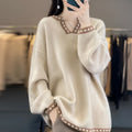 Women's white V-neck long sleeve viscose pullover sweater on a hanger.
