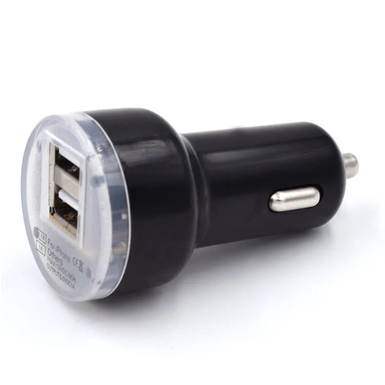 Black or white two-port car charger plugging into a 12V vehicle socket for in-car USB charging