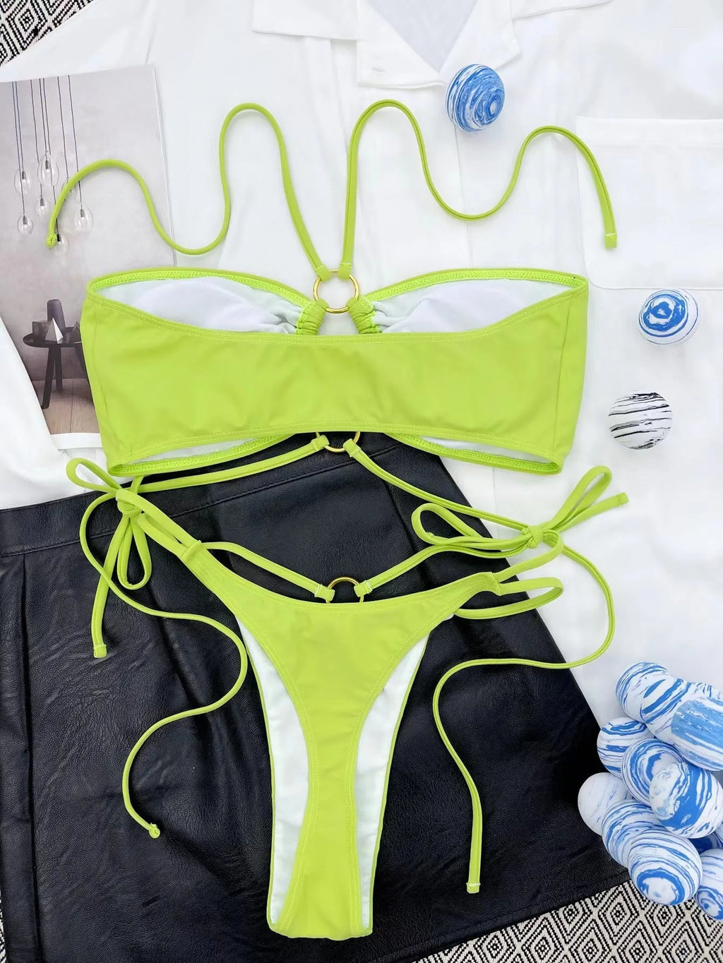 Women's yellow green lace-up triangle bikini swimsuit on mannequin