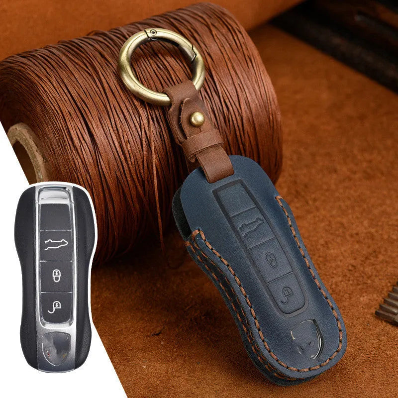 Porsche leather key case in retro style with bag buckle fastening in blue colour