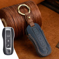 Porsche leather key case in retro style with bag buckle fastening in blue colour