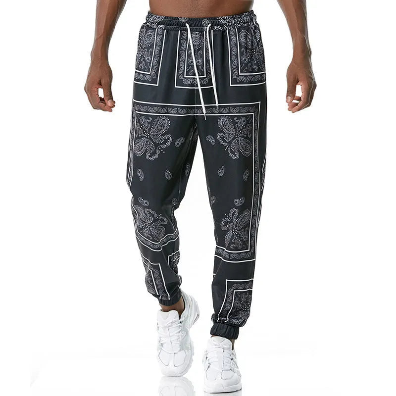 Printed jogging pants in loose fit with drawstring waist, small leg opening, and ribbed hem, available in multiple colours