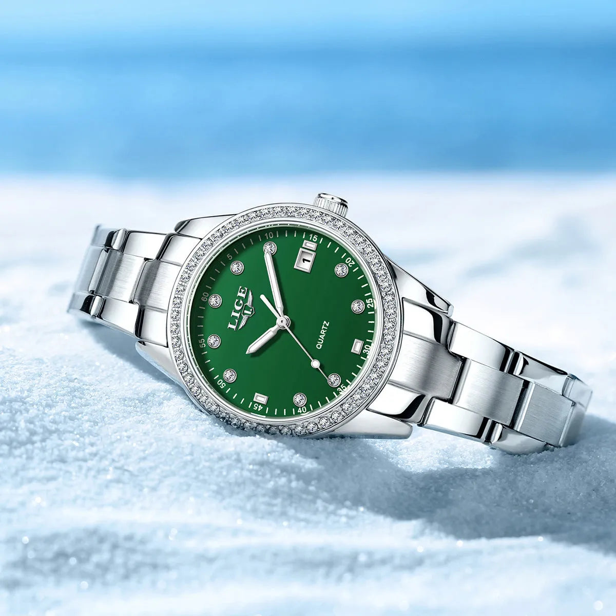 Silver Fashion Girl watch with round diamond-encrusted dial on stainless steel strap, showing luminous hands.
