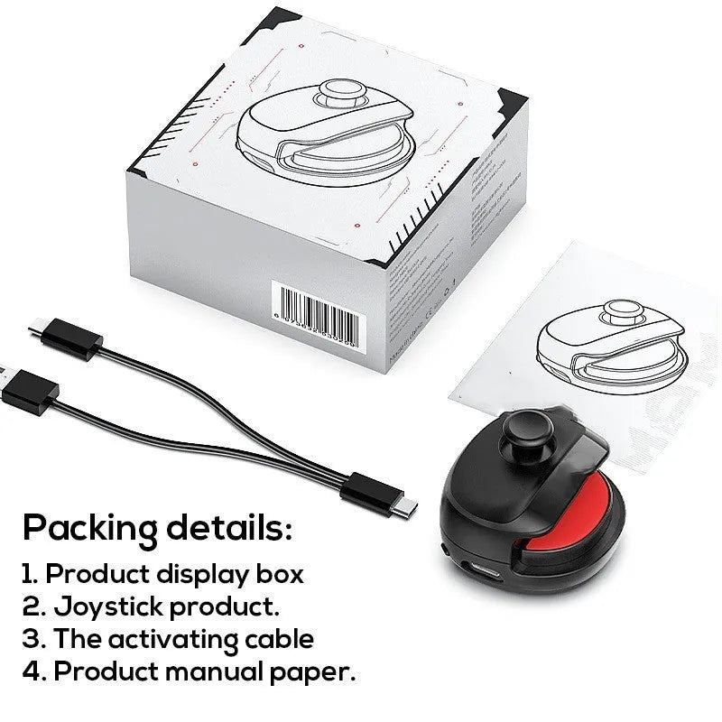Compact black and white USB gaming stick controller on a flat surface, showing its size and ergonomic design.