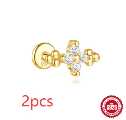 S925 sterling silver geometric moon and star earrings with diamond detail on a gold tone background.