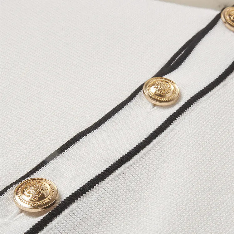 White short-sleeve cardigan with dark contrast colour lapels, buttoned front, and a relaxed fit.