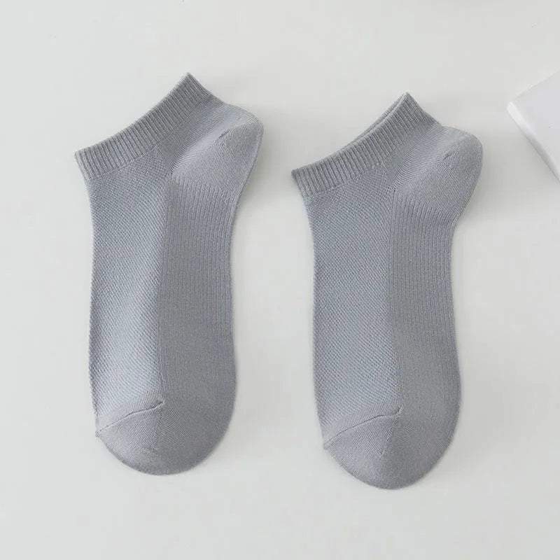 Men's solid colour polyester low-cut boat socks shown in multiple colour options