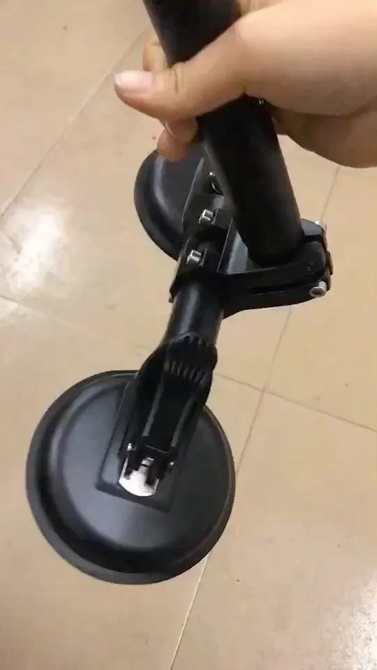 Black off-road car glass sucker base with round rubber disc for windscreen mounting.