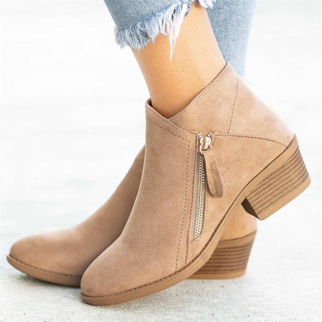 Women's blue suede ankle boots with a chunky heel and a side zip fastener