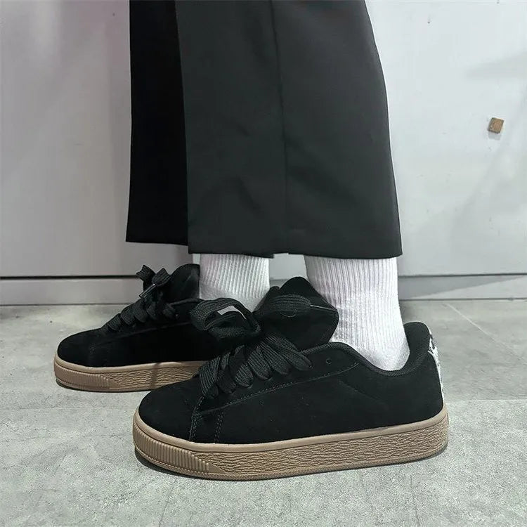 Black retro low-top sneakers with waterproof platform and round toe design