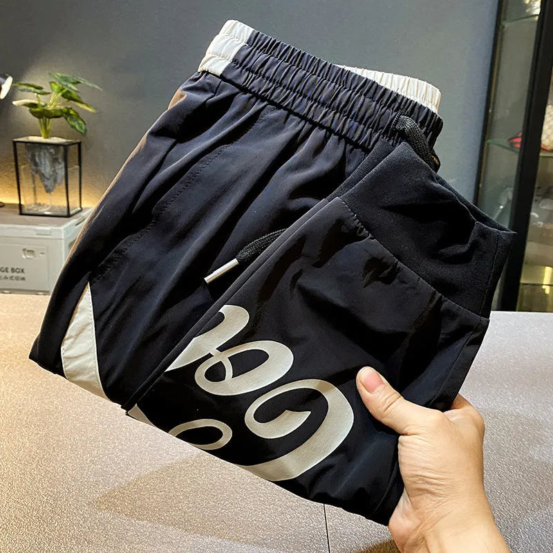 Black men's cropped casual trousers with ankle banding made from ultra-thin ice silk and cotton.