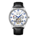 Men's stainless steel mechanical watch with a leather strap and sapphire crystal glass on a wrist.