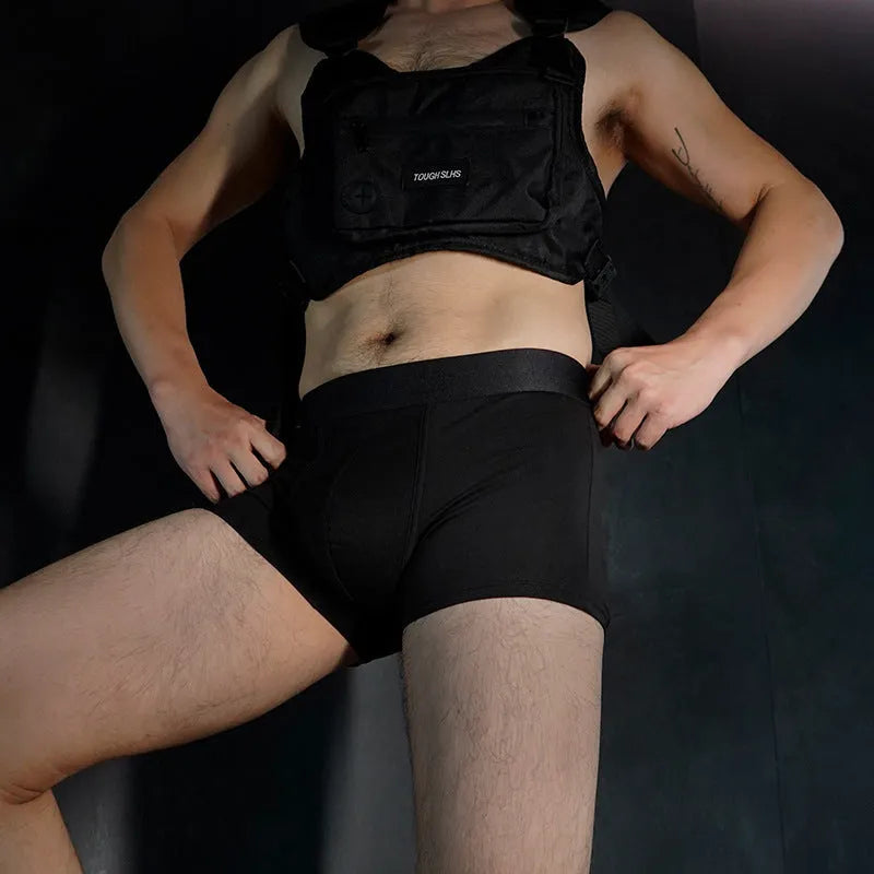 Men's solid colour cotton boxer shorts in black, shown flat.