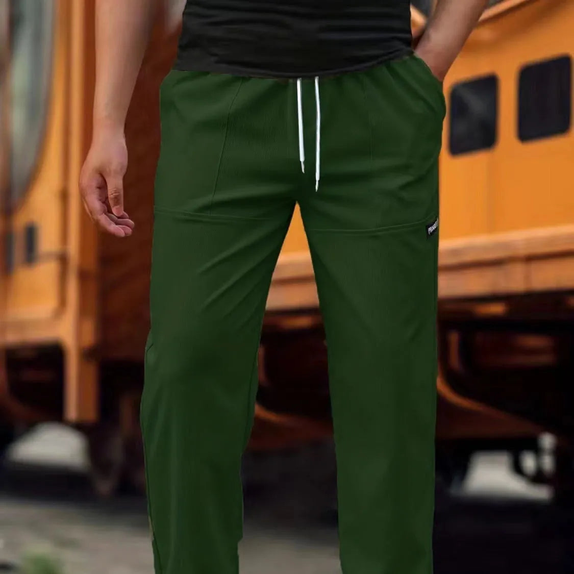 Men's light grey polyester casual trousers for spring and autumn wear.