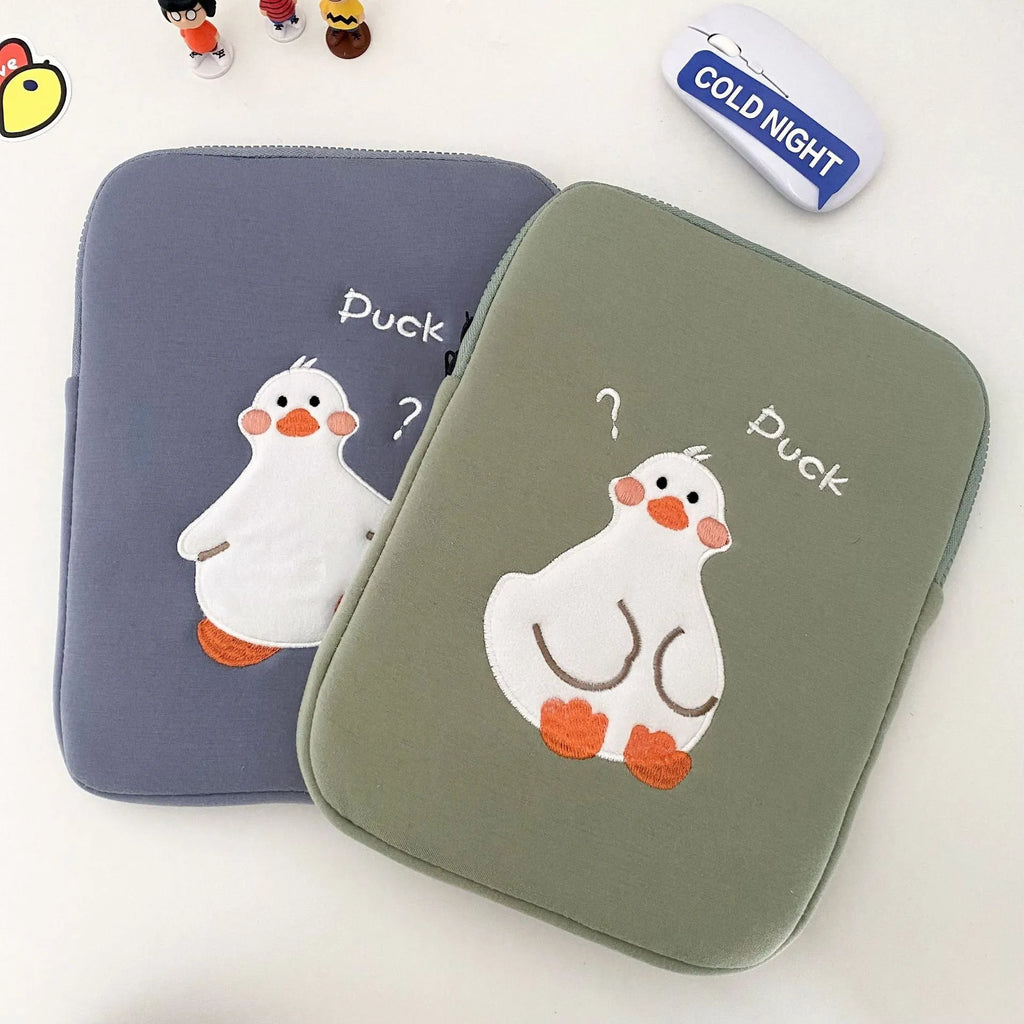 Blue cotton tablet case with a cartoon duck embroidery design and a silver zipper closure.