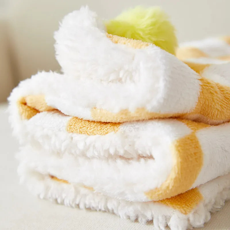 Soft plush pet blanket with plaid pattern and fur ball decoration for cats and dogs