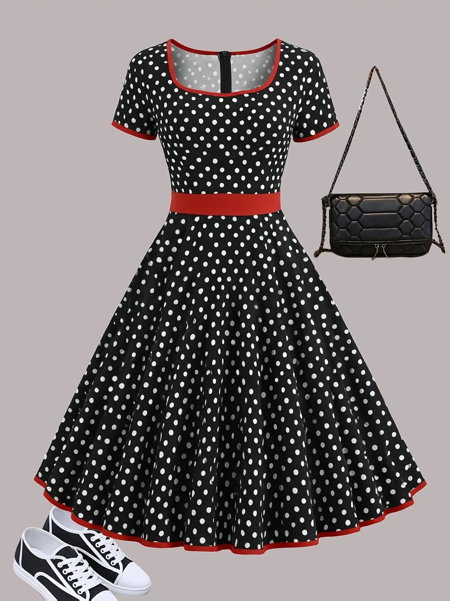 Multicolour polka dot dress with square collar, short sleeves, front zipper, and pleated midi skirt on a hanger.