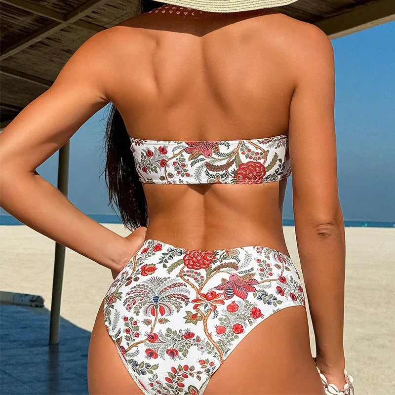 Women's printed bandeau swimsuit set with strapless top and high-waisted shorts on a neutral background.