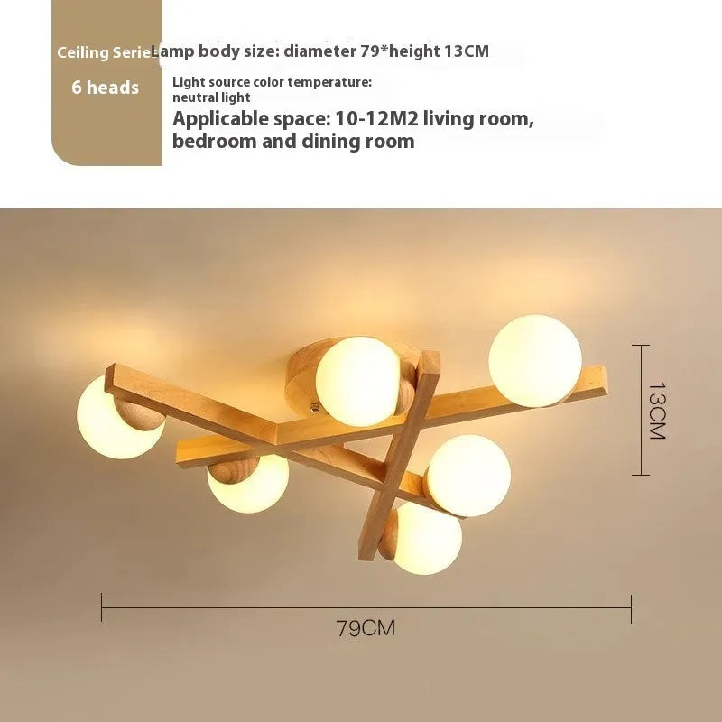 Scandinavian wooden-style ceiling light with three adjustable black lamp heads on angled arms