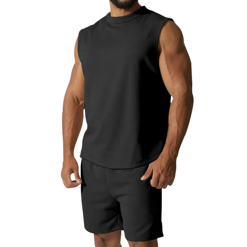 Men's sleeveless cotton blend sports top and matching shorts in a solid colour, laid flat.