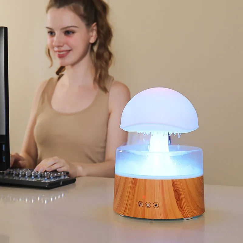 White cloud-shaped humidifier with rainfall effect and colour changing night light