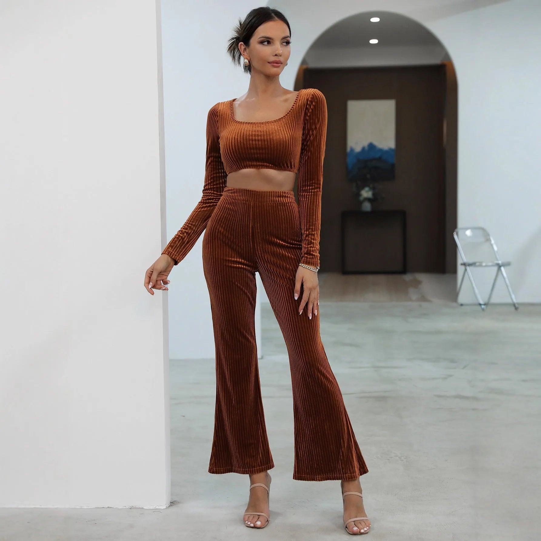 Caramel coloured long sleeve top and matching trousers laid flat, a casual two-piece sweater set.