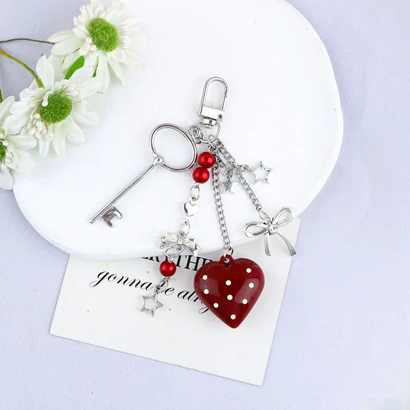 Retro zinc alloy key ring with bow and love heart chain design in multiple colour options