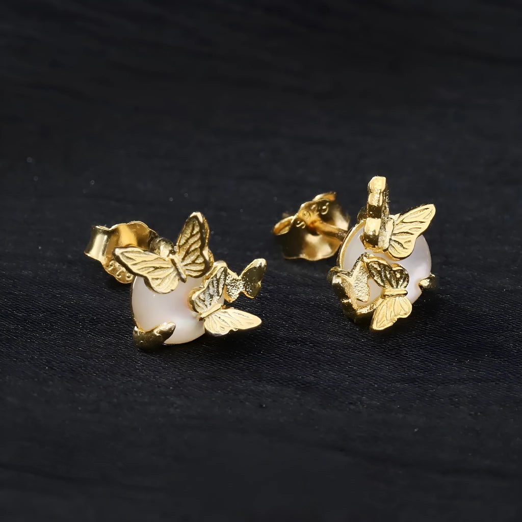 A pair of 925 silver butterfly ear studs with an electroplated finish in either white gold or gold colour.