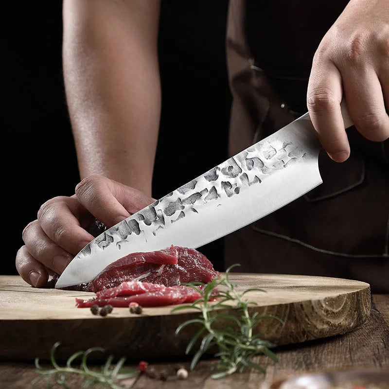 Hand-forged stainless steel kitchen knife set with 7 blades on a wooden cutting board