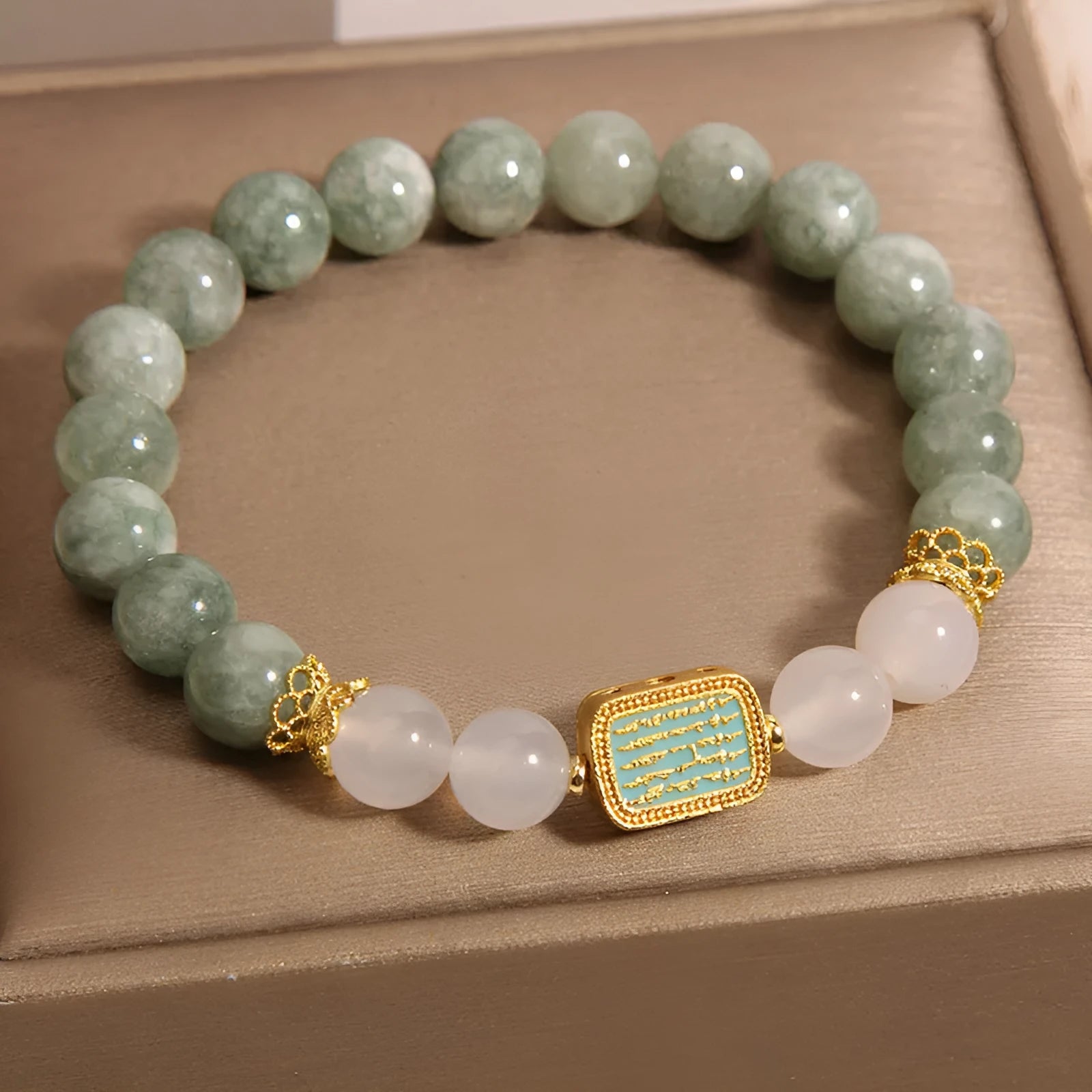 Women's oil green emerald crystal bracelet showing five engraved scripture sections