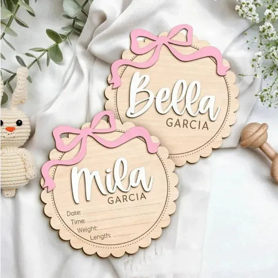Square wooden baby room ornament with a customised name, shown in two size options.