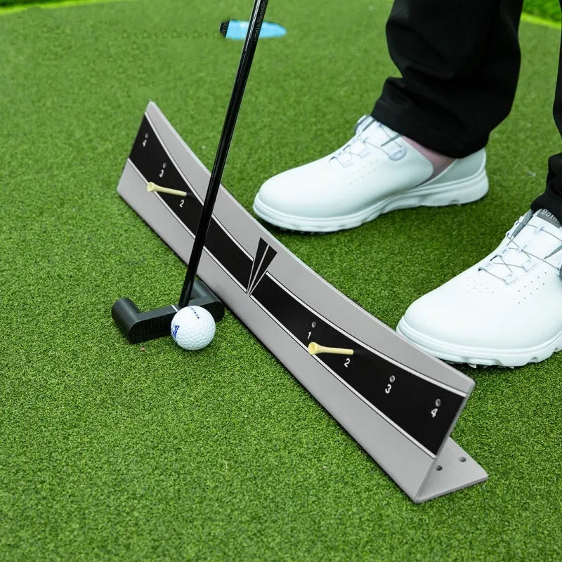 Golf putter trajectory balance simulator with adjustable PVC push rod on a green carpet
