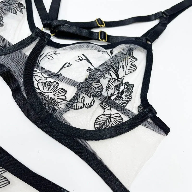 Black women's lace mesh floral print three-piece set showing top, pants, and waist ring.