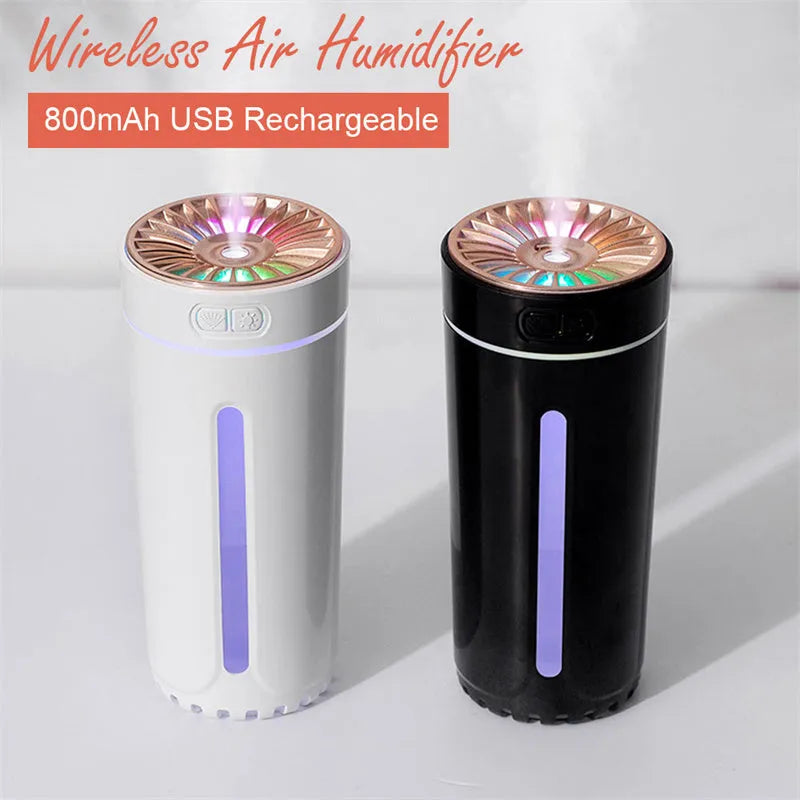 Black portable USB rechargeable humidifier with colourful lights on a car cup holder.