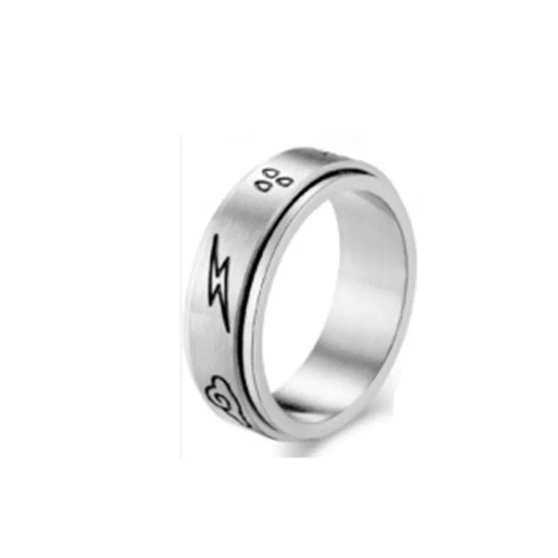 Titanium steel star moon ring in glossy finish on a neutral background, showing celestial motif and band width